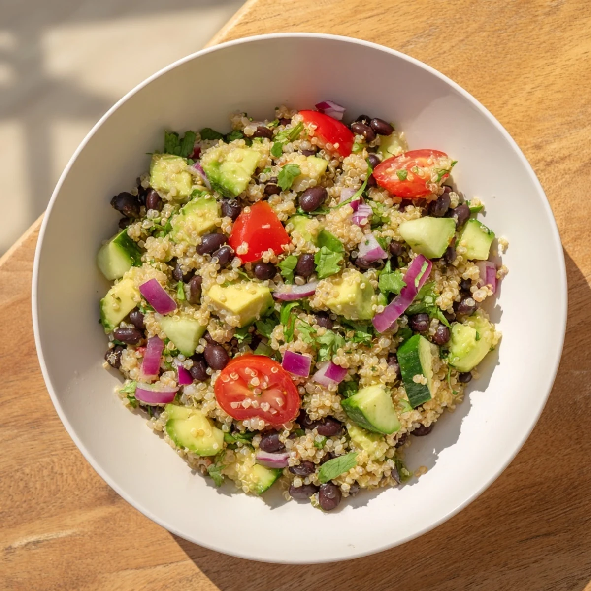 Close-up of a flavorful quinoa and black bean salad, ready for a healthy, delicious meal.