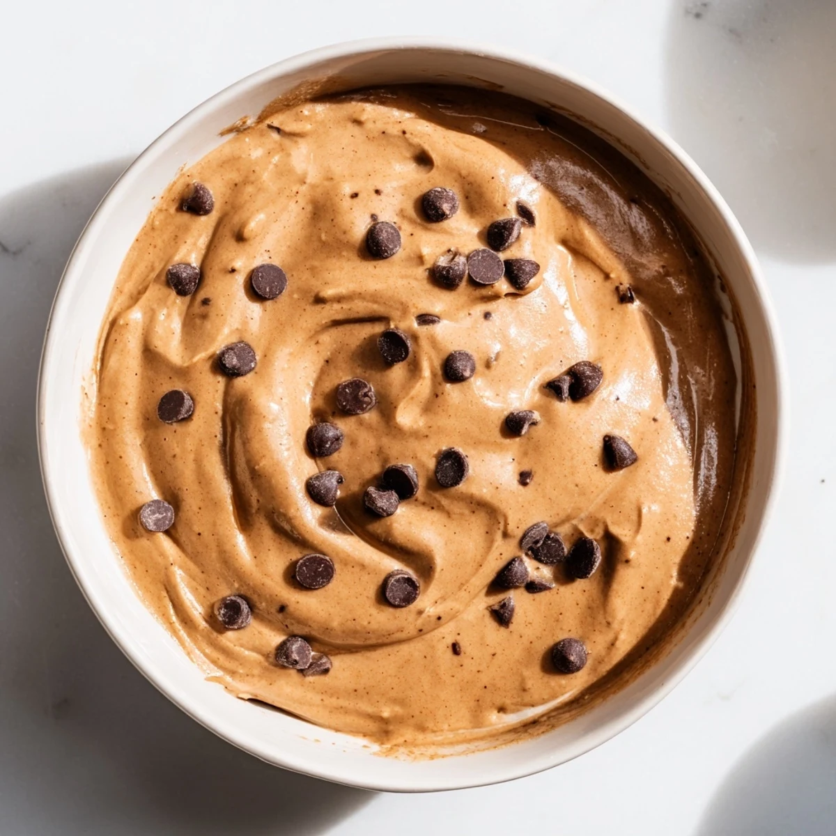 Enjoy this easy dessert: a bowl of homemade, gluten-free brownie batter dip served.