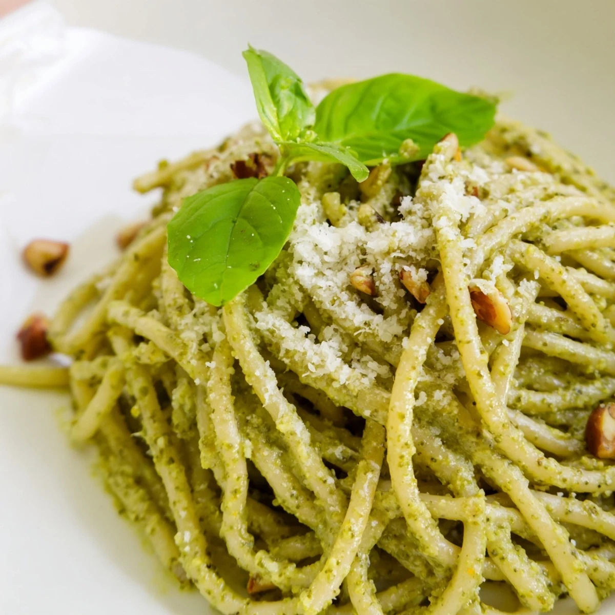 A warm bowl of Creamy Sunflower Seed Pesto Pasta with golden pasta and vibrant green pesto.