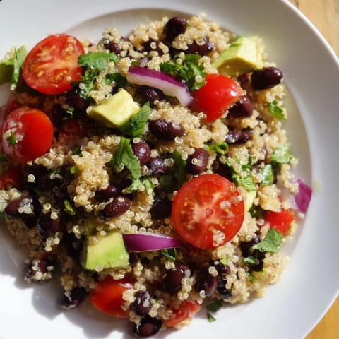 Chilled Quinoa Black Bean Salad with black beans, red pepper, and cilantro, perfect for lunch.