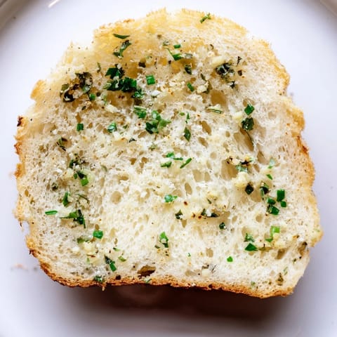 A close-up view of airy, gluten-free cloud bread savory toasts, showcasing the fluffy texture and melted Parmesan within each bite.