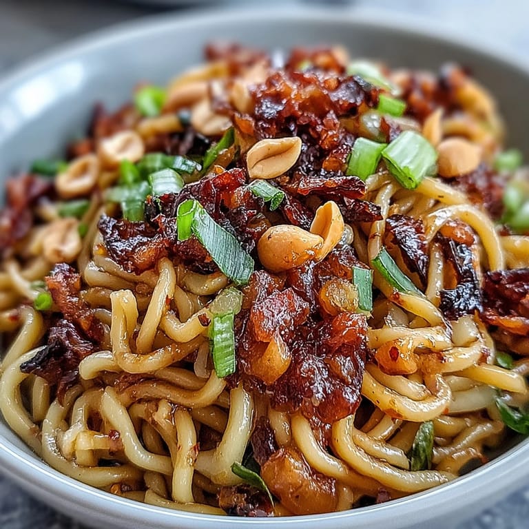Vibrant Chili Crisp Noodles with chewy wheat noodles tossed in savory chili oil and fresh aromatics.