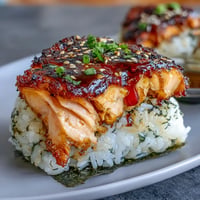 Golden grilled salmon onigiri, crisped and ready for a delicious Japanese snack.